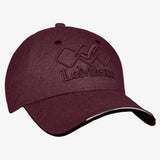 Maroon textured fabric lemieux baseball cap with embroidered logo and black trim featuring a unique seamless shell design