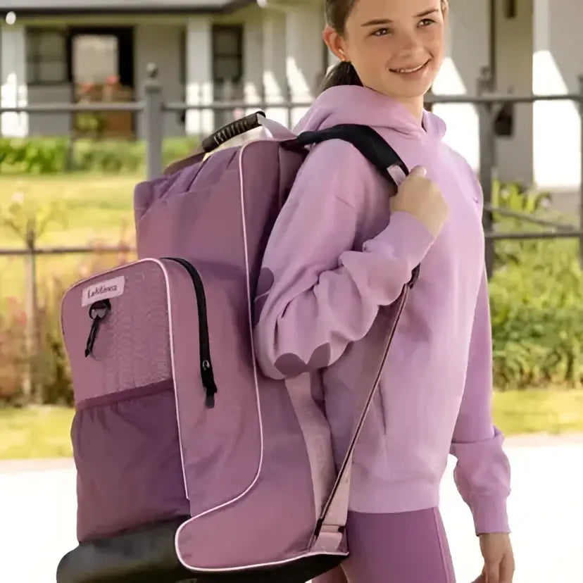 Purple lemieux boot and hat bag mallow with black trim and textured front pocket made of waterproof nylon