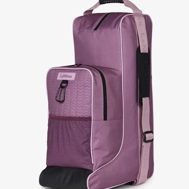 Purple lemieux boot and hat bag mallow with quilted waterproof nylon, black accents, and wheels for easy travel