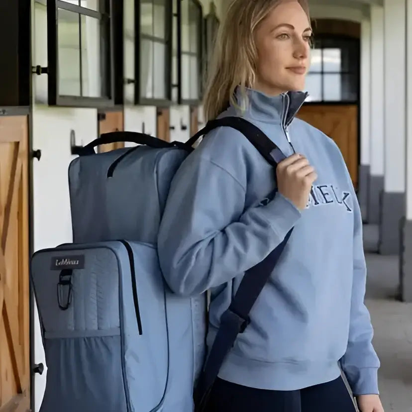 Light blue lemieux boot and riding hat bag made of waterproof nylon with black straps and eclipse brand label