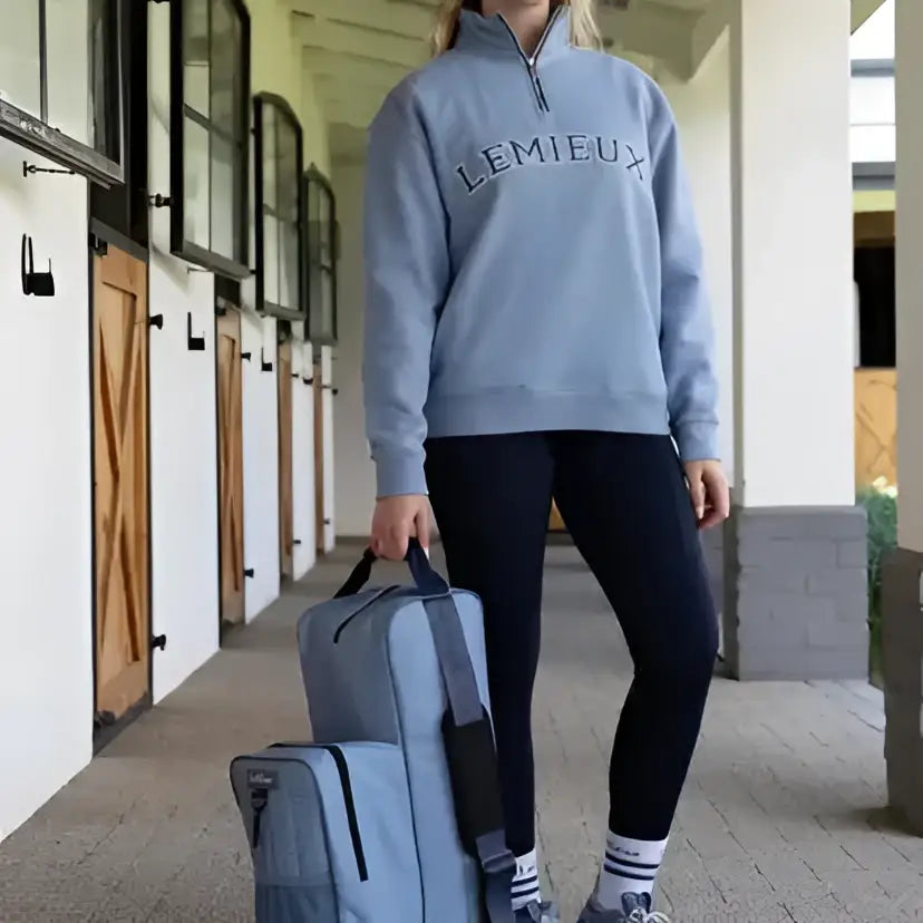 Lemieux boot and riding hat bag in powder blue waterproof nylon with black straps and zipper details
