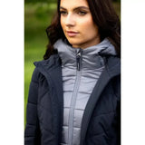 Dark navy quilted lemieux brioney hybrid jacket with gray puffer inner layer and branded zipper pull for cold weather