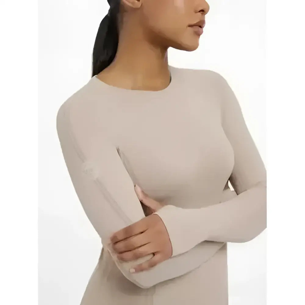 Beige lemieux britney seamless long sleeve top with subtle logo on left sleeve perfect for athletic wear