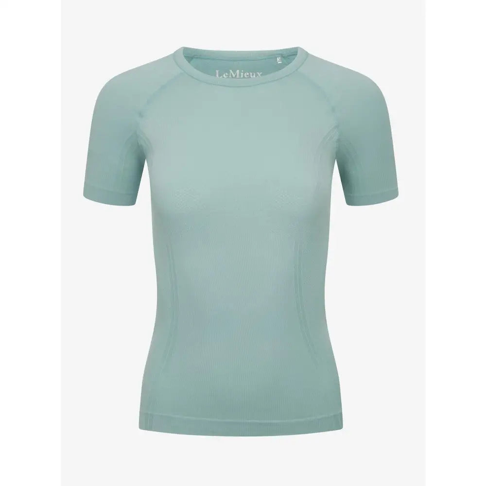 A soft mint green lemieux britney seamless short sleeve athletic top with raglan sleeves and round neckline