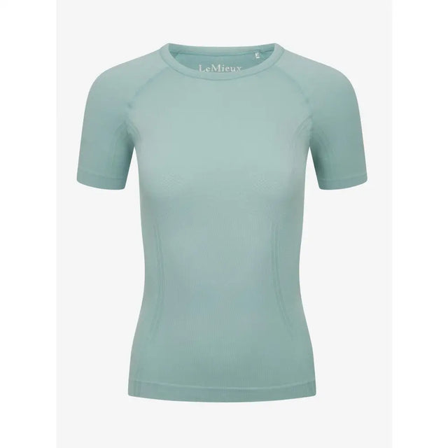 A soft mint green lemieux britney seamless short sleeve athletic top with raglan sleeves and round neckline