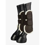 Black lemieux capella comfort tendon boot with white shearling lining and adjustable straps for cutting edge protection
