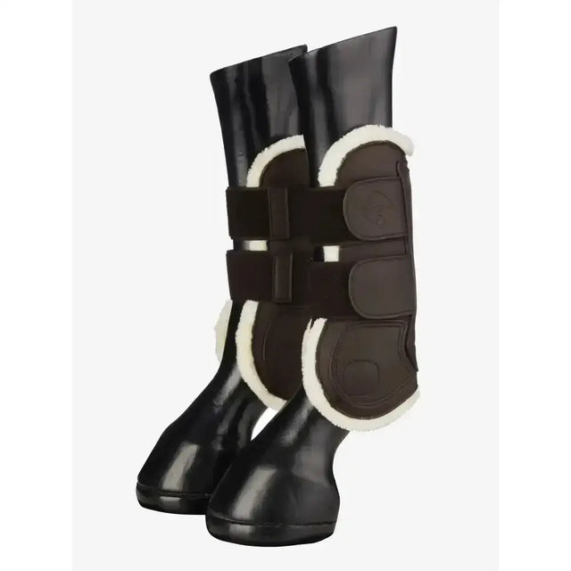 Black lemieux capella comfort tendon boot with white shearling lining and adjustable straps for cutting edge protection