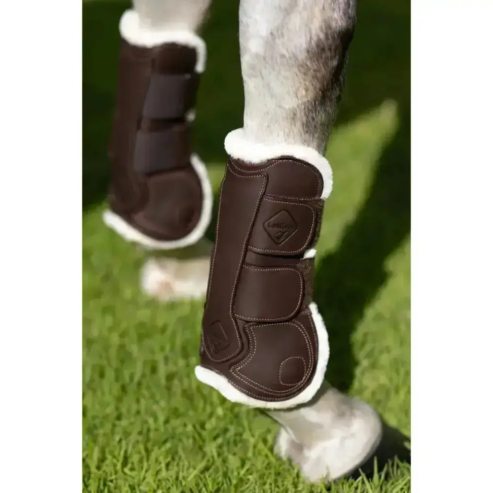Brown leather lemieux capella comfort tendon boot with white fleece lining and three straps for cutting edge protection