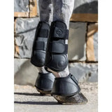 Black lemieux capella tendon boots with adjustable straps and textured durable material for cutting edge protection