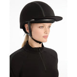 Equestrian in black attire wearing Lemieux Carmine Hat Silk Black riding helmet