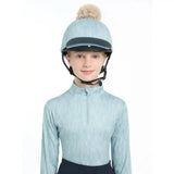 Light blue lemieux casey hat silk glacier with black visor and beige fluffy pom-pom for equestrian riding