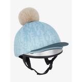 Light blue suede lemieux casey hat silk glacier with subtle pattern and fluffy beige pom-pom on top