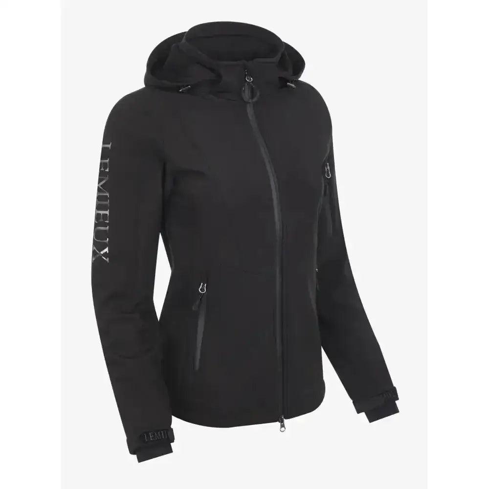 Black tempeux women wearing lemieux celine soft shell jacket black with hood and subtle silver branding on sleeve and zipper pulls
