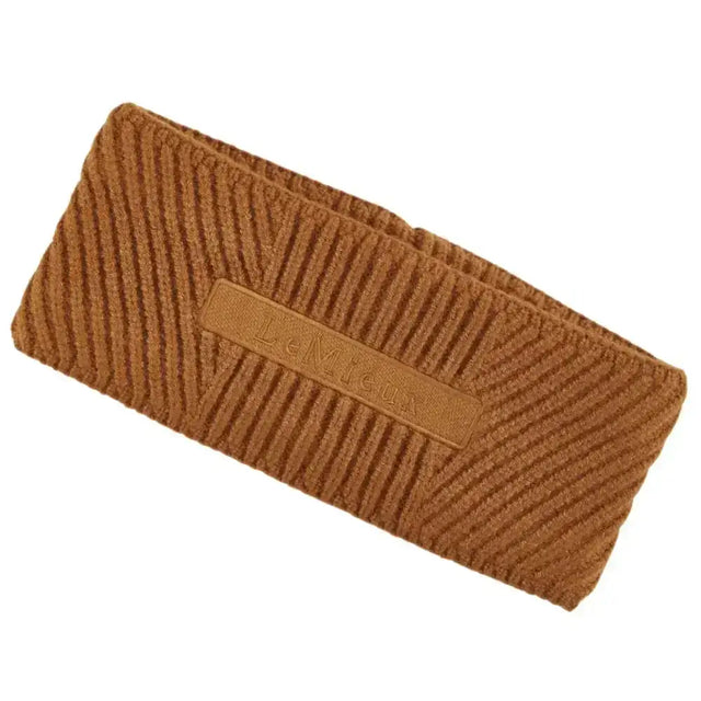 Brown corduroy lemieux clara cable headband with subtle embossed logo patch in cable headband ginger color