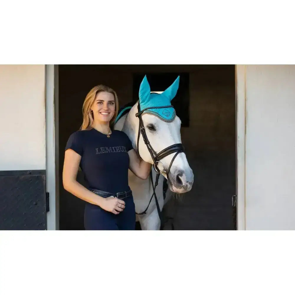 Bright turquoise lemieux classic fly ear cover with subtle logo and cotton face veil for fly hood azure use