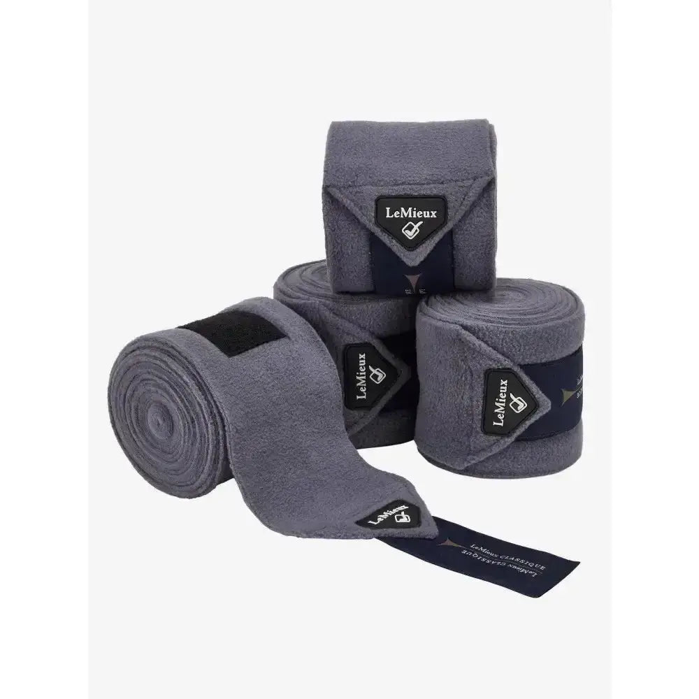 Gray lemieux classic polo fleece exercise bandages with black branding tags rolled up, ideal for polo or stable use