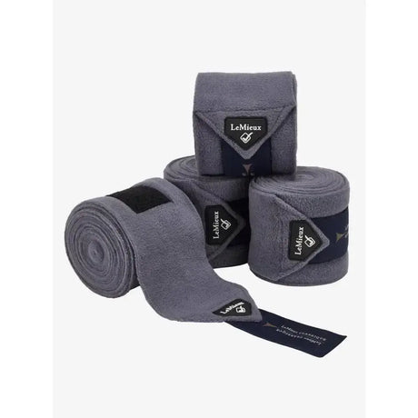 Gray lemieux classic polo fleece exercise bandages with black branding tags rolled up, ideal for polo or stable use