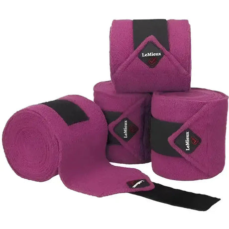 Lemieux classic polo bandages in fuchsia with black elastic bands and diamond lemieux logos on fleece wraps