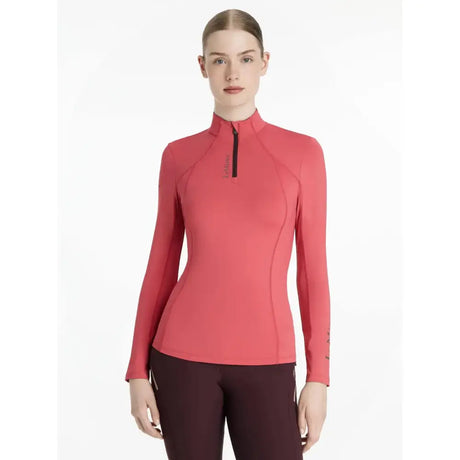 A coral-colored lemieux classique base layer cranberry with long sleeves high collar and black zipper detail