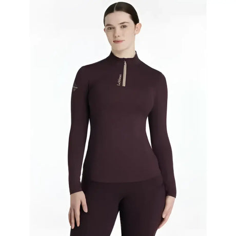 A maroon lemieux classique base long-sleeved damson layer with high collar zipper and subtle chest branding