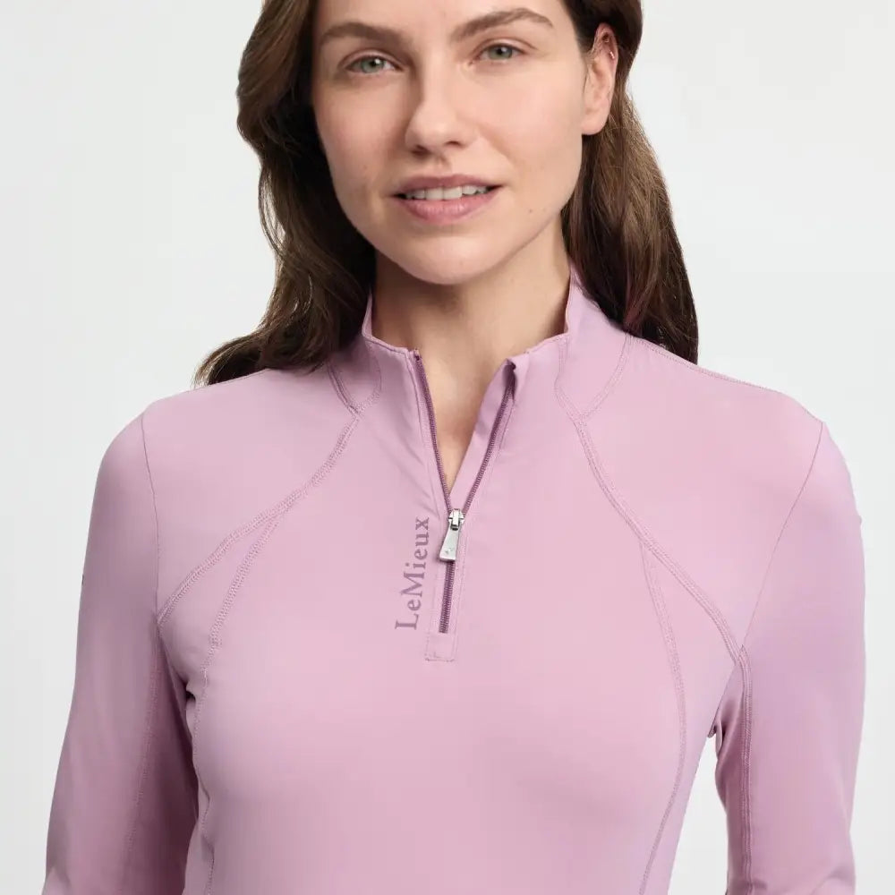 A soft lavender lemieux classique base long-sleeved performance top with quarter-zip and subtle seam detailing