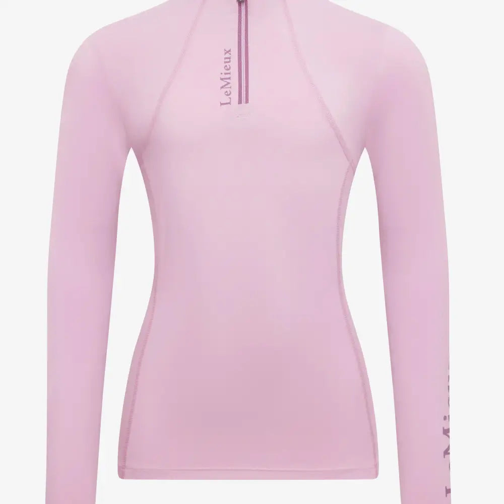 A soft pink lemieux classique base layer fondant long sleeve top with quarter zip and subtle chest branding