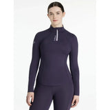 A navy blue long sleeve lemieux classique base layer juniper top with high collar zipper and lémiax logo on chest