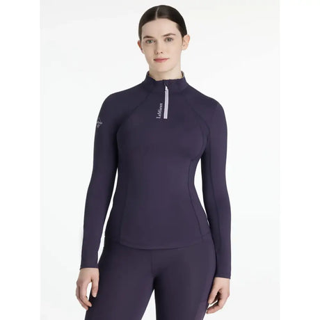 A navy blue long sleeve lemieux classique base layer juniper top with high collar zipper and lémiax logo on chest