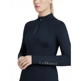 Black long sleeved performance top with subtle silver lemieux classique branding for navy layer base use
