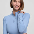 Light blue lemieux classique base layer with quarter-zip collar vented underarms and powder blue branding