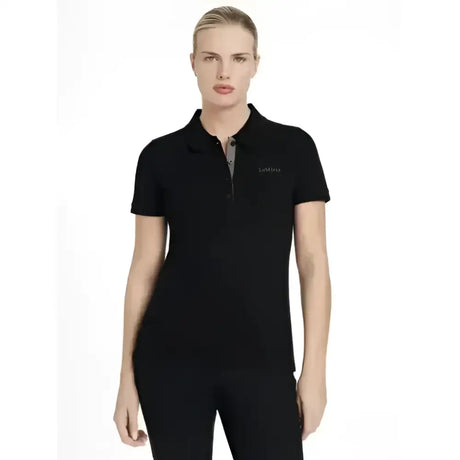 Black short-sleeved lemieux classique polo shirt with subtle embroidered logo on left chest perfect for casual wear