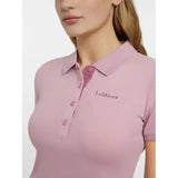 A soft pink lemieux classique polo shirt blossom with short sleeves, subtle textured weave, and embroidered logo on chest