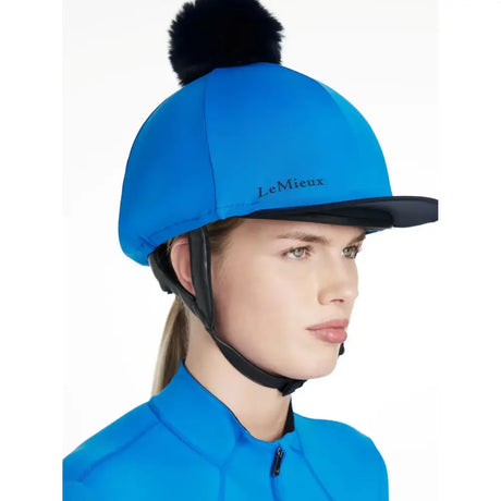 Bright blue lemieux classique pom hat silk benetton helmet cover with black pom pom and trim in silk benetton blue