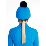 Bright blue lemieux classique pom equestrian helmet with black fluffy pom hat silk benetton blue on top
