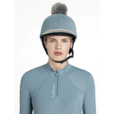 Light blue lemieux classique pom hat silk ice blue equestrian helmet with gray faux fur pom pom on top