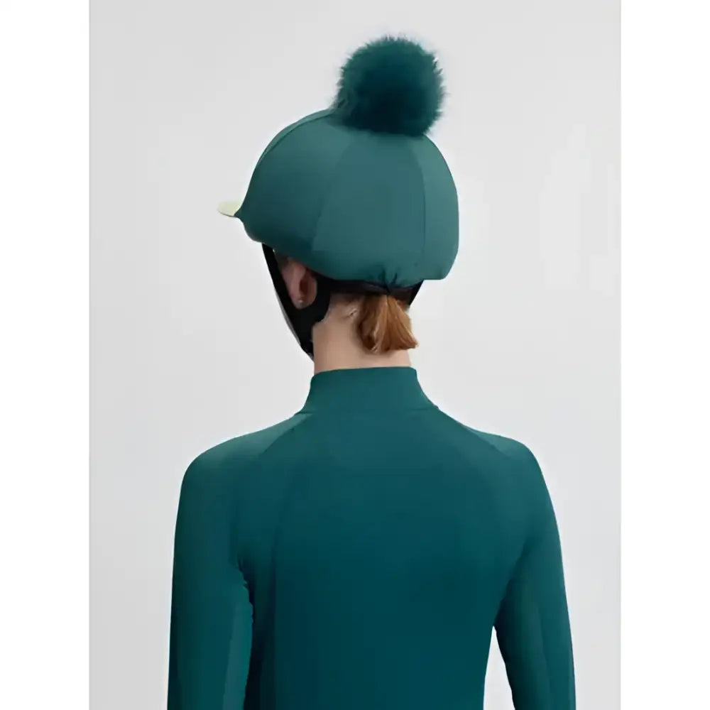 Teal lemieux classique equestrian helmet with fluffy green faux fur pom in silk jungle style