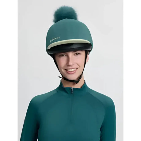 Teal lemieux classique equestrian helmet with a silk jungle faux fur pom perfect for riding style