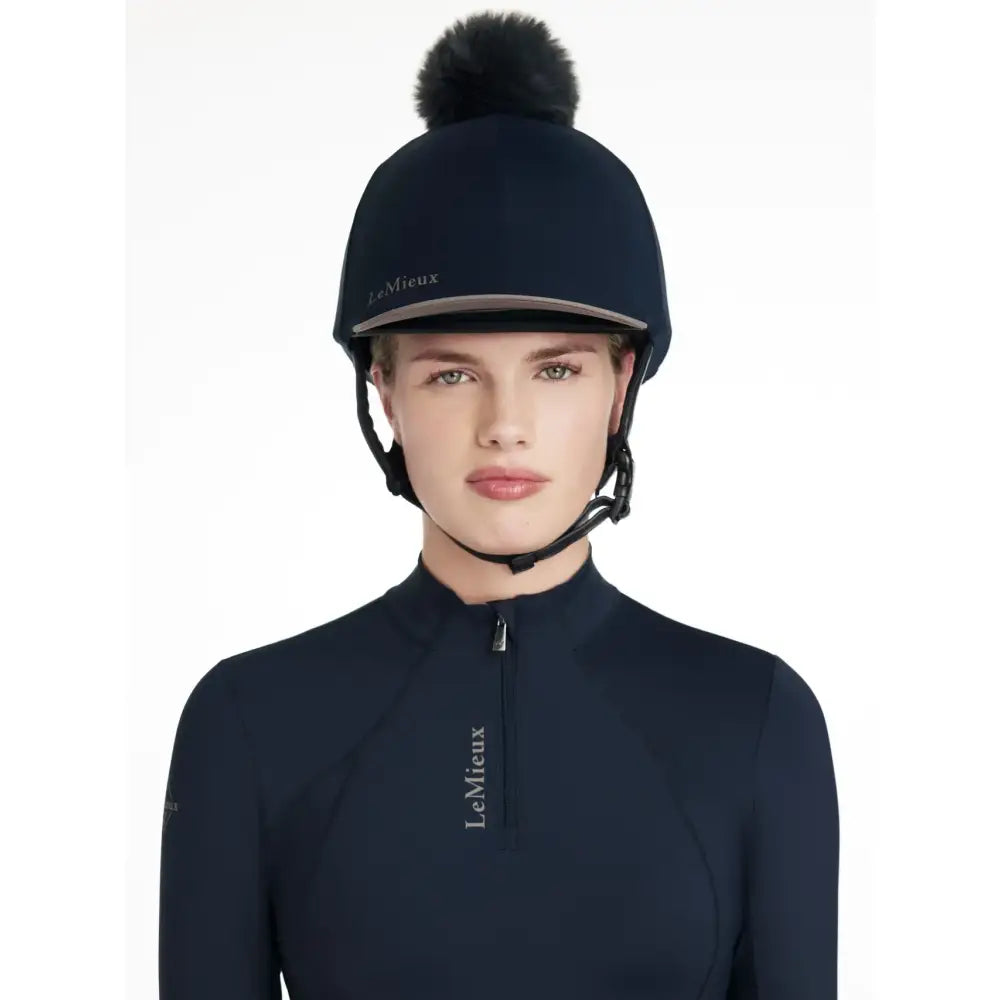Navy blue lemieux classique pom silk navy hat with black faux fur pom pom designed for equestrian use