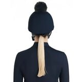 Navy blue lemieux classique pom silk navy hat with a fluffy black pom hat silk for equestrian use