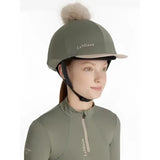 Olive green lemieux classique pom equestrian helmet with fluffy beige pom hat silk rosemary and white logo embroidered