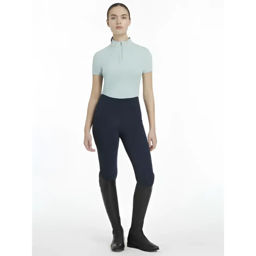 Light blue lemieux classique short sleeve classic equestrian top with high collar and front zipper aqua base layer