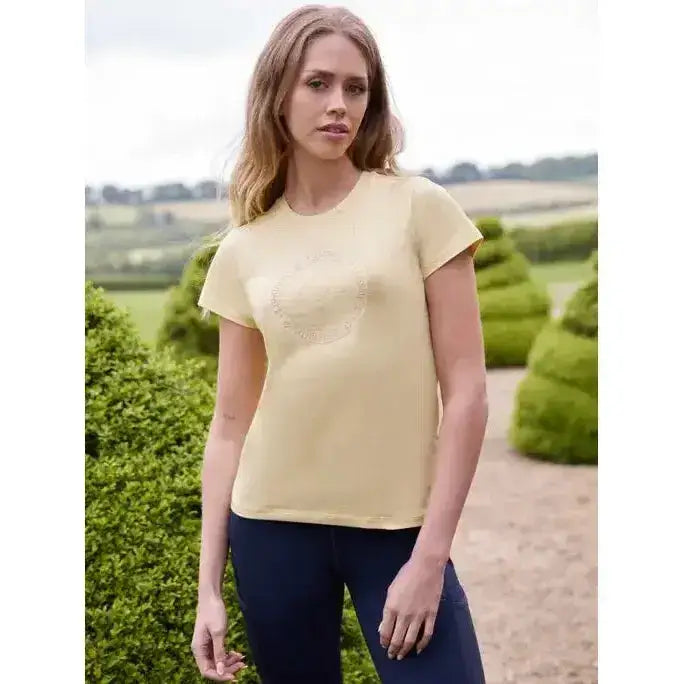 A pale yellow lemieux classique short-sleeved t-shirt with a subtle circular embellishment perfect for equestrian style