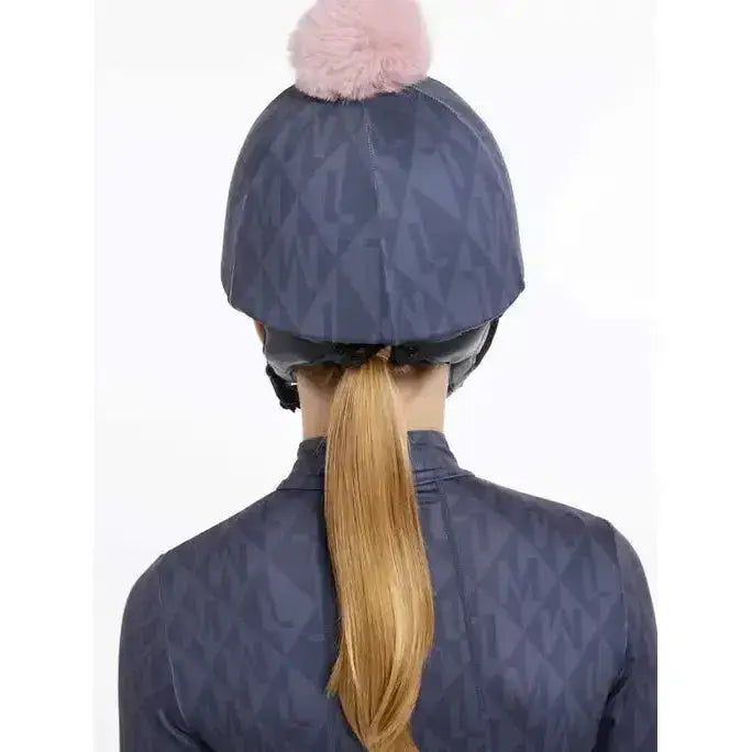 Navy blue geometric patterned lemieux clea hat silk dusk blue equestrian helmet cover with soft pink pom pom on top