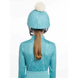 Teal diamond patterned lemieux clea hat silk lagoon equestrian helmet with white pom pom on top