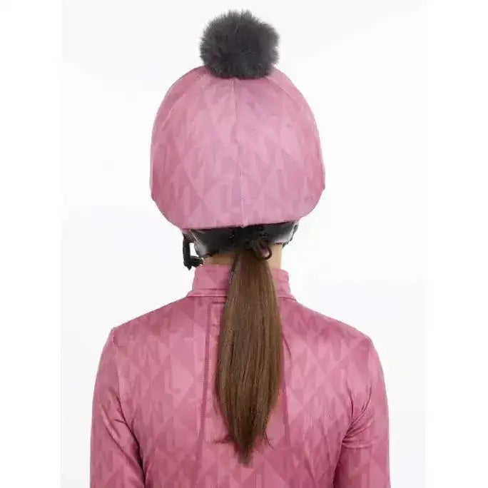 Pink quilted lemieux clea hat silk peony with black faux fur pom-pom on top perfect for stylish warmth