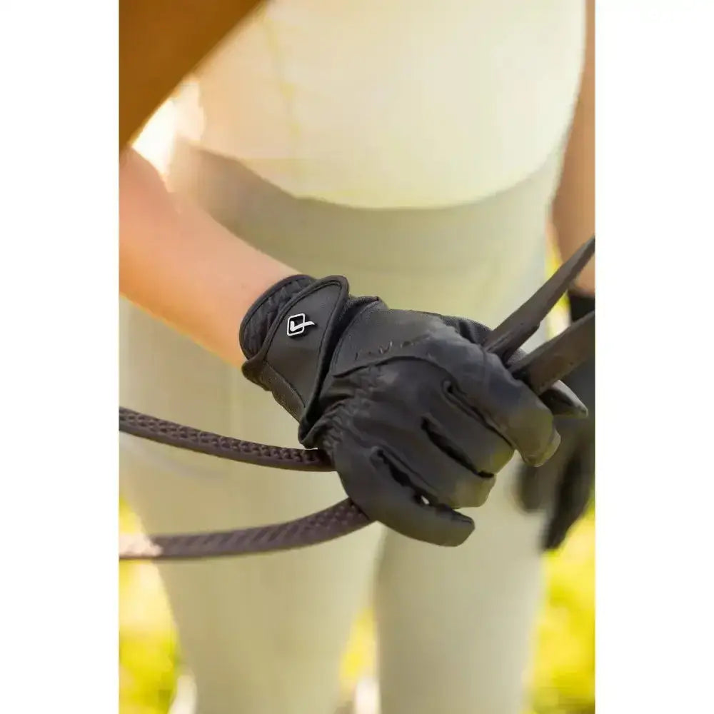 Black lemieux close contact glove with small white logo on wrist strap made from innovative technical fabric