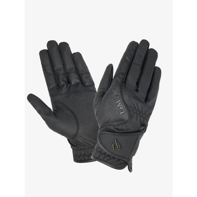 Black leather lemieux close contact glove with subtle embossed logo and adjustable wrist strap in innovative technical fabric