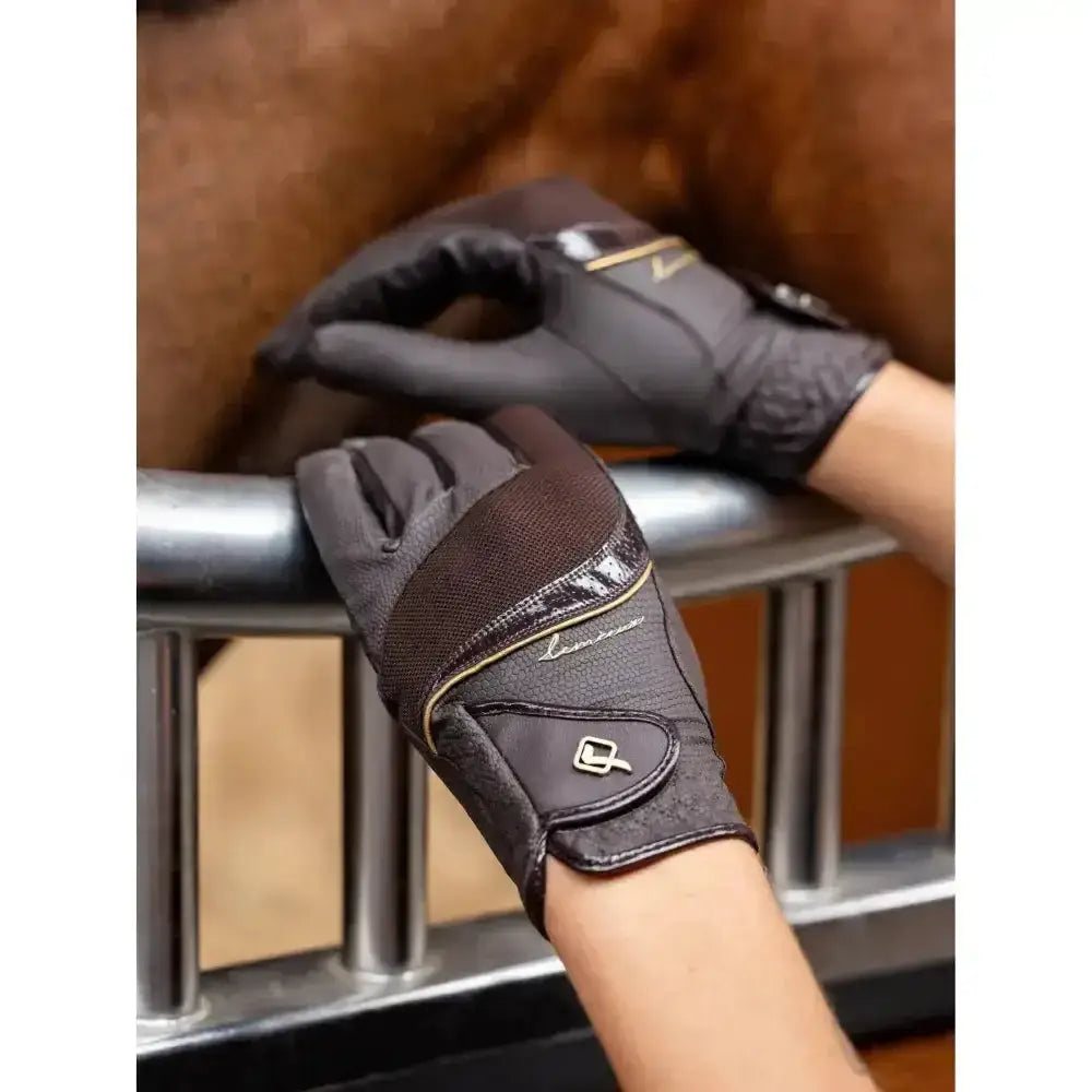 Black and brown lemieux competition gloves with glossy finish gold stitching and updated construction for closer contact feel