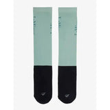 A pair of lemieux competition socks in mint green and black with subtle i am text on the upper leg