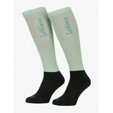 Light green and black lemieux competition socks with subtle upper leg logo perfect for riding and performance use